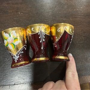 3 red with gold shot glasses